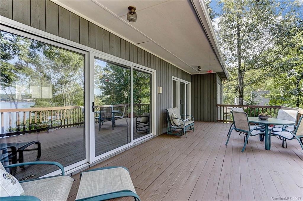 31001 Executive Point Tega Cay, SC 29708 - Photo 19 of 24 a balcony with furniture and wooden floor