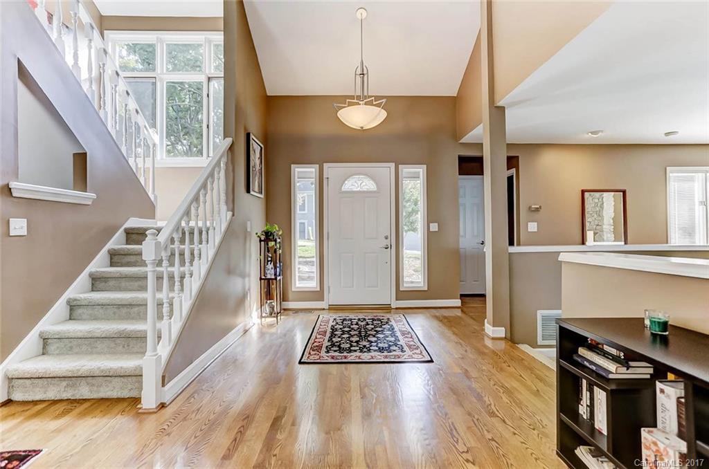 31001 Executive Point Tega Cay, SC 29708 - Photo 3 of 24 a view of a livingroom with wooden floor and furniture