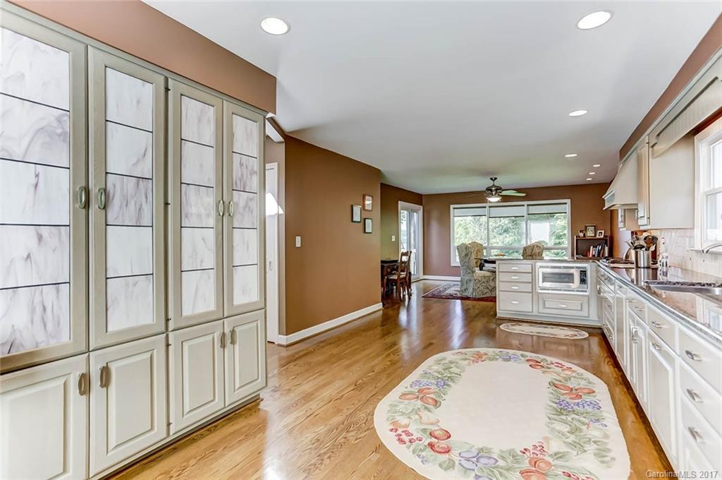 31001 Executive Point Tega Cay, SC 29708 - Photo 9 of 24 swimming pool view with a large window and wooden floor