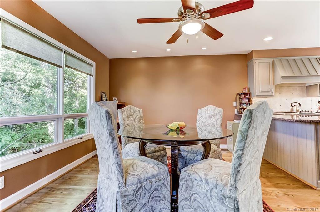 31001 Executive Point Tega Cay, SC 29708 - Photo 10 of 24 a view of a dining room with furniture window and outside view
