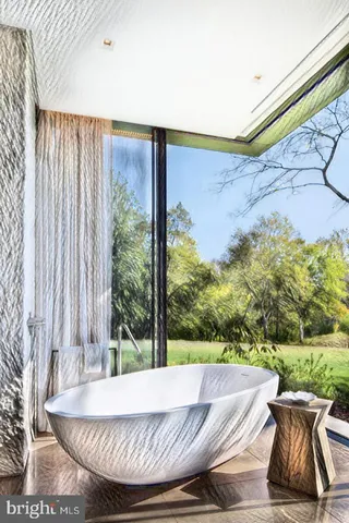 a outdoor living space with furniture and garden view