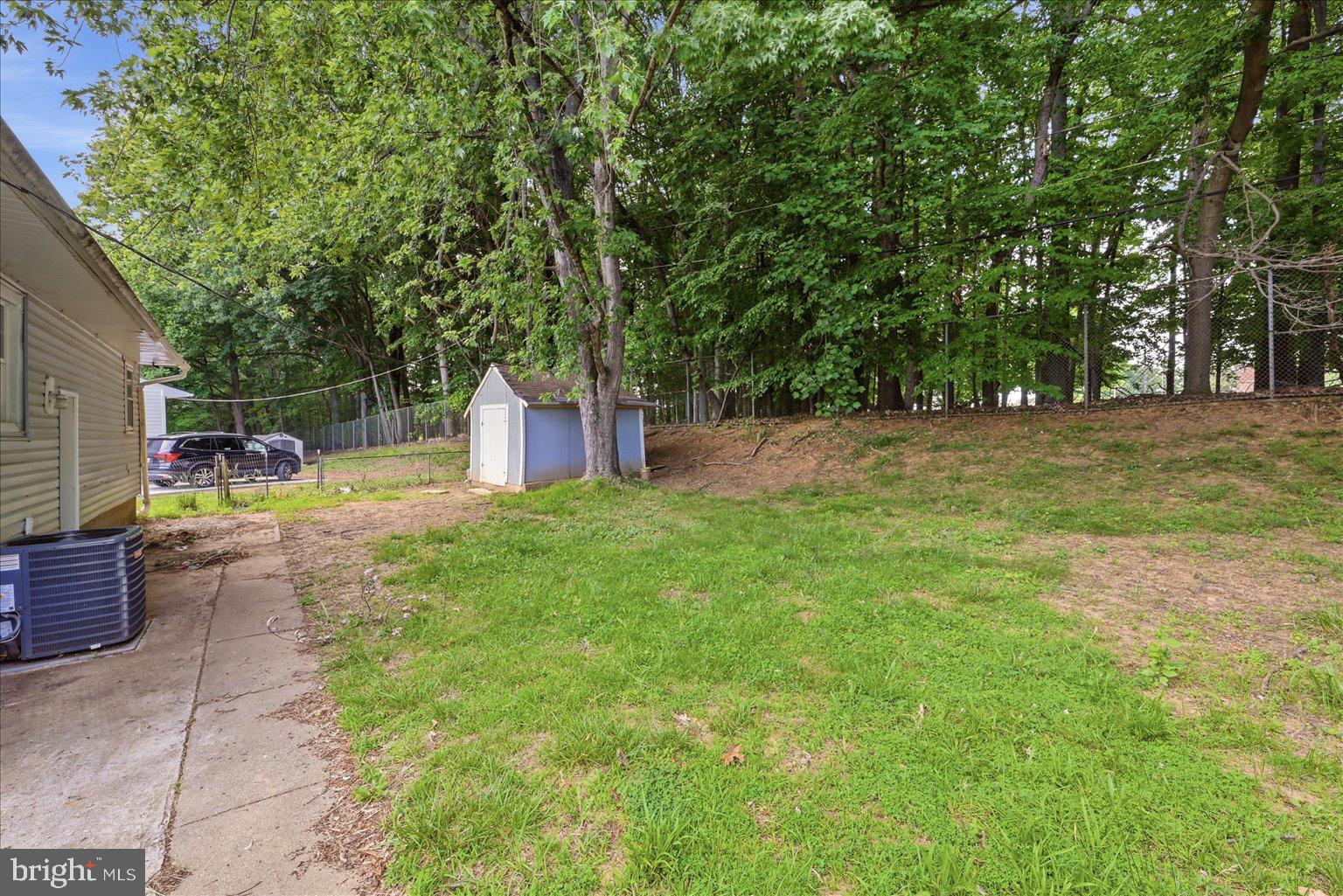 9110 Meadow Heights Road Randallstown, MD 21133 - Photo 36 of 39 Spacious yard bordered by lush trees.
