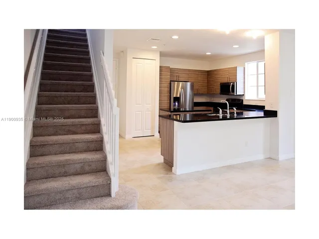 a kitchen with a sink and a stove