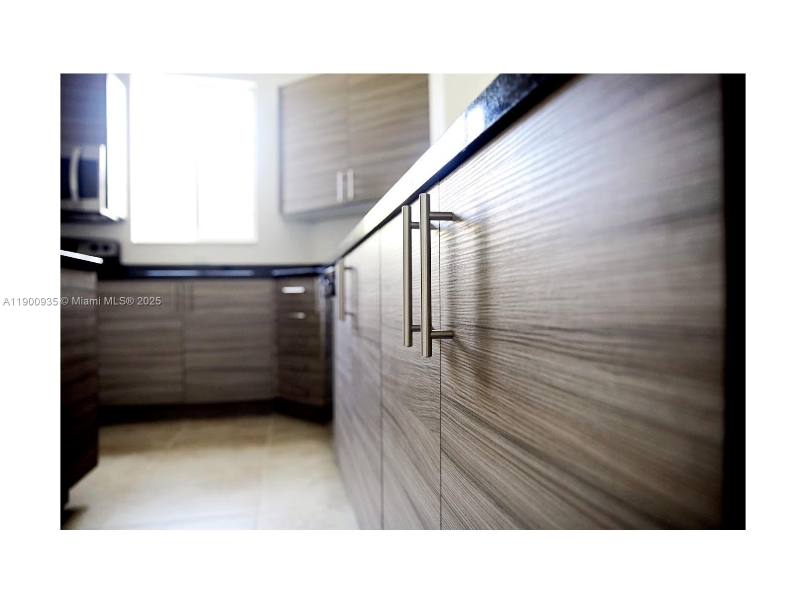 2714 Southwest 81st Terrace, Unit 2718 Miramar, FL 33025 - Photo 4 of 12 a black and white photo of a room