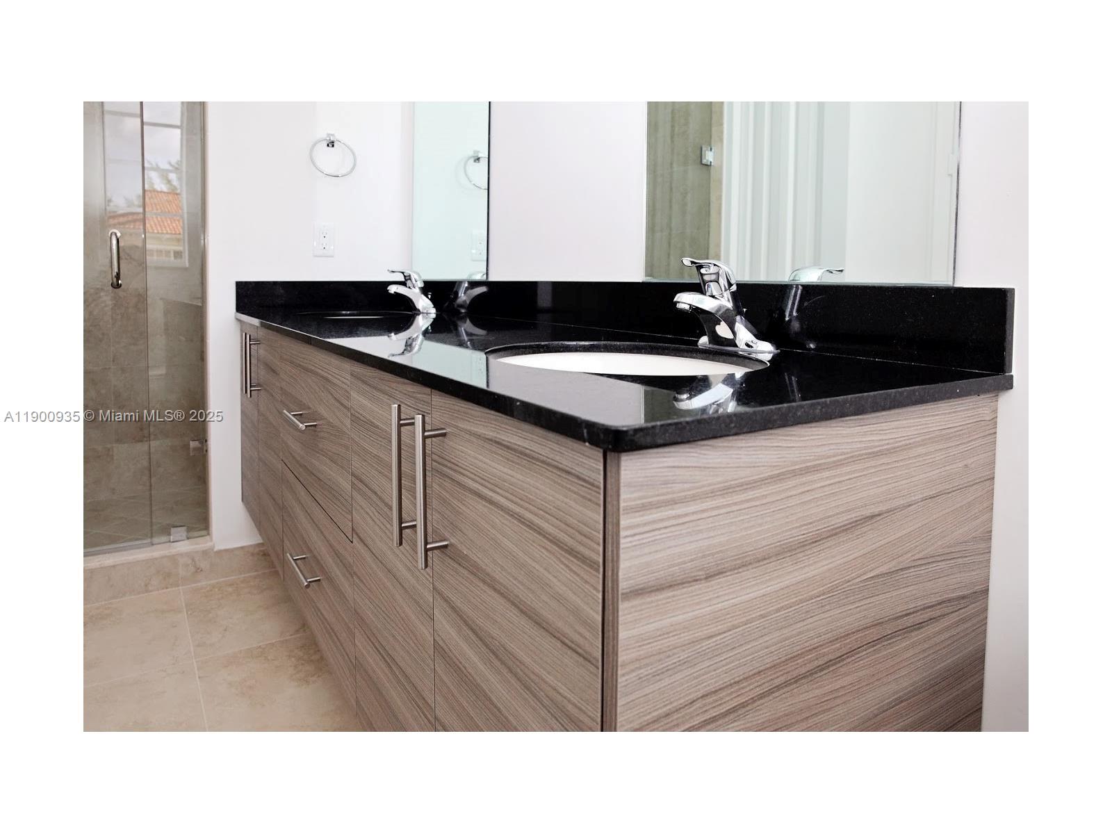 2714 Southwest 81st Terrace, Unit 2718 Miramar, FL 33025 - Photo 8 of 12 a black and white photo of a mirror