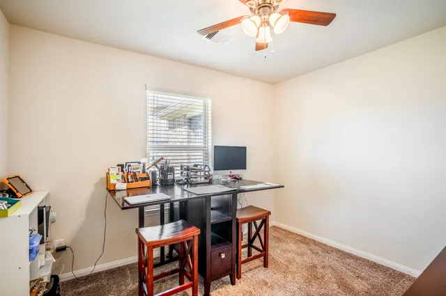 a view of a dining room with furniture
