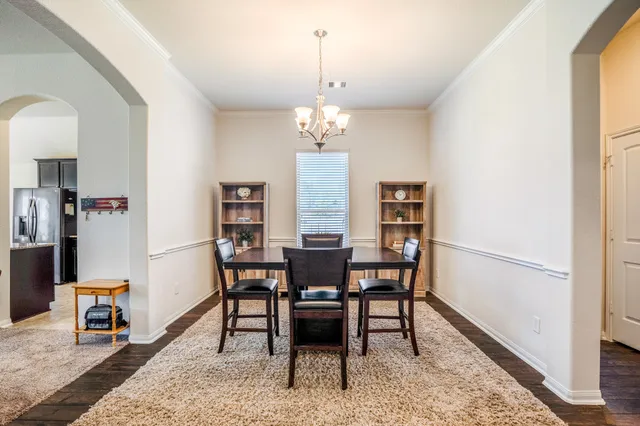 a living room with furniture fireplace and flat screen tv