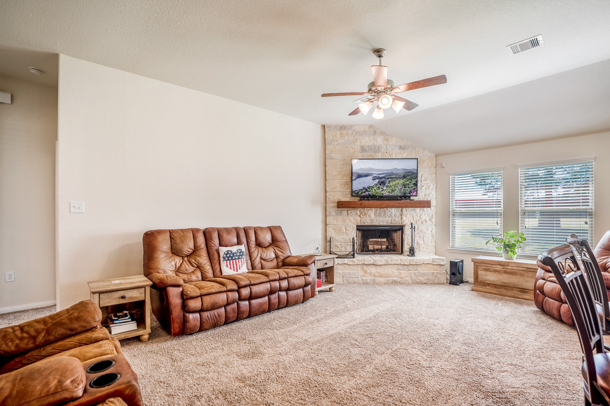 1730 Wandering Hills Road Conroe, TX 77304 - Photo 18 of 45 a living room with furniture and fireplace
