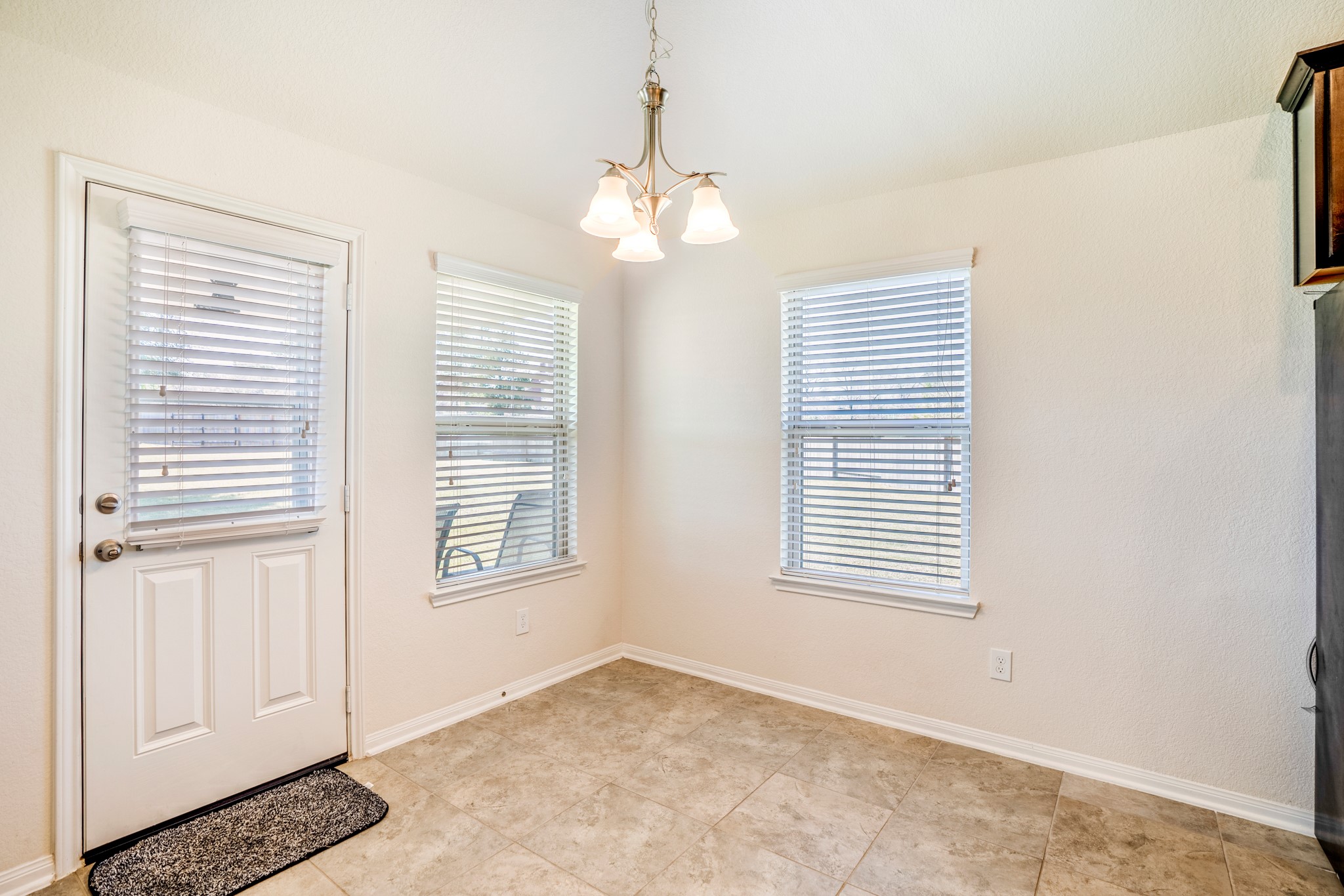 1730 Wandering Hills Road Conroe, TX 77304 - Photo 21 of 45 a view of an empty room with a window