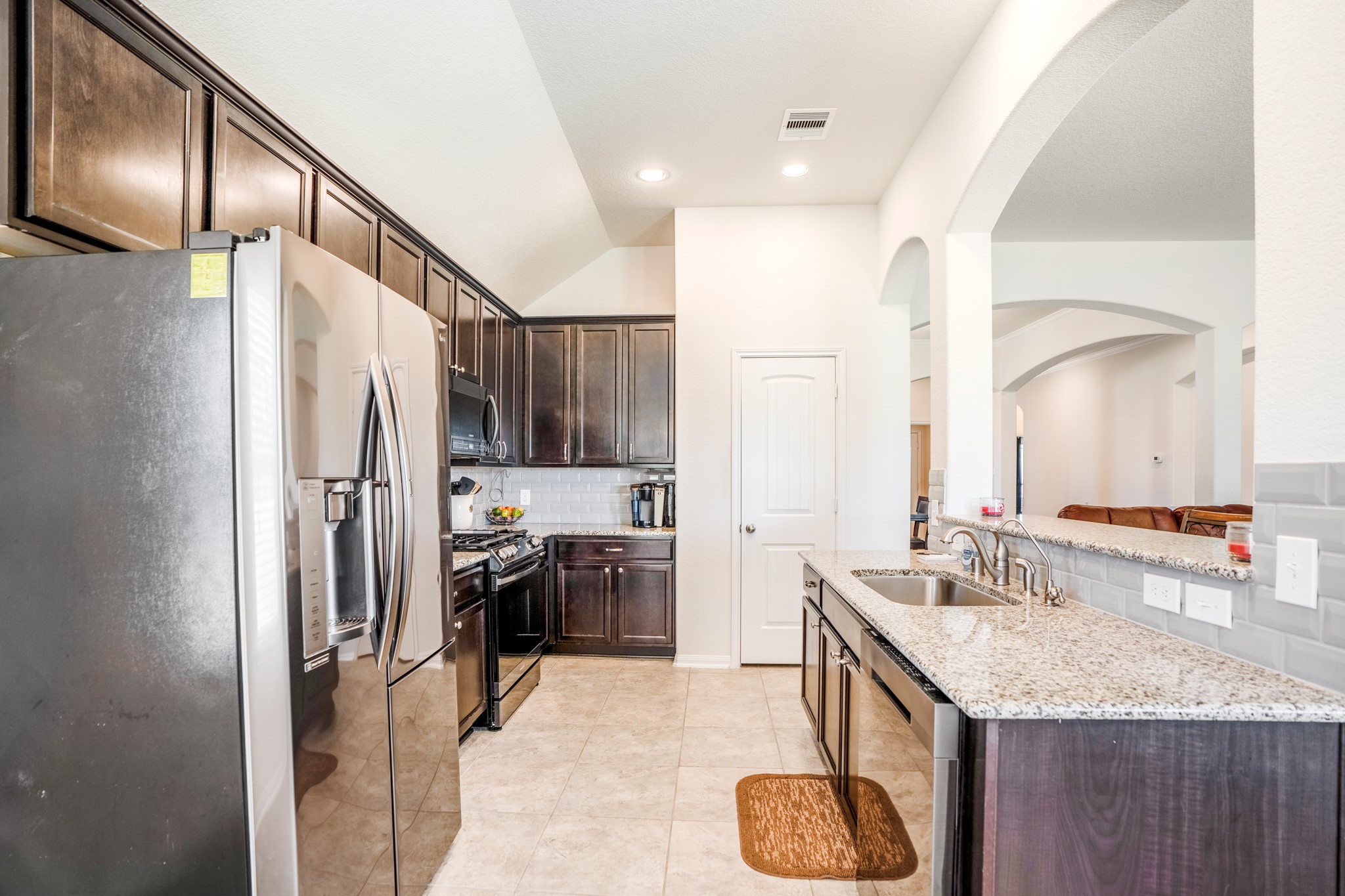 1730 Wandering Hills Road Conroe, TX 77304 - Photo 23 of 45 a bathroom with a granite countertop sink and a mirror