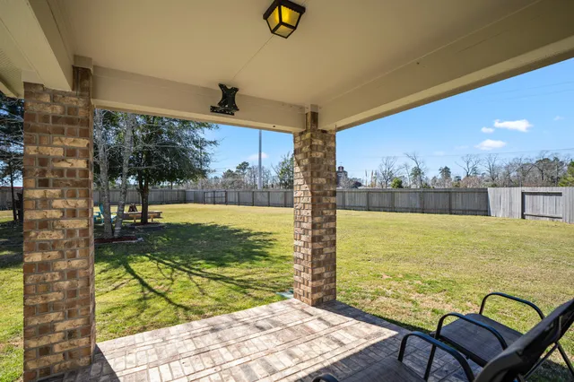 a view of a swimming pool with an outdoor space and seating area