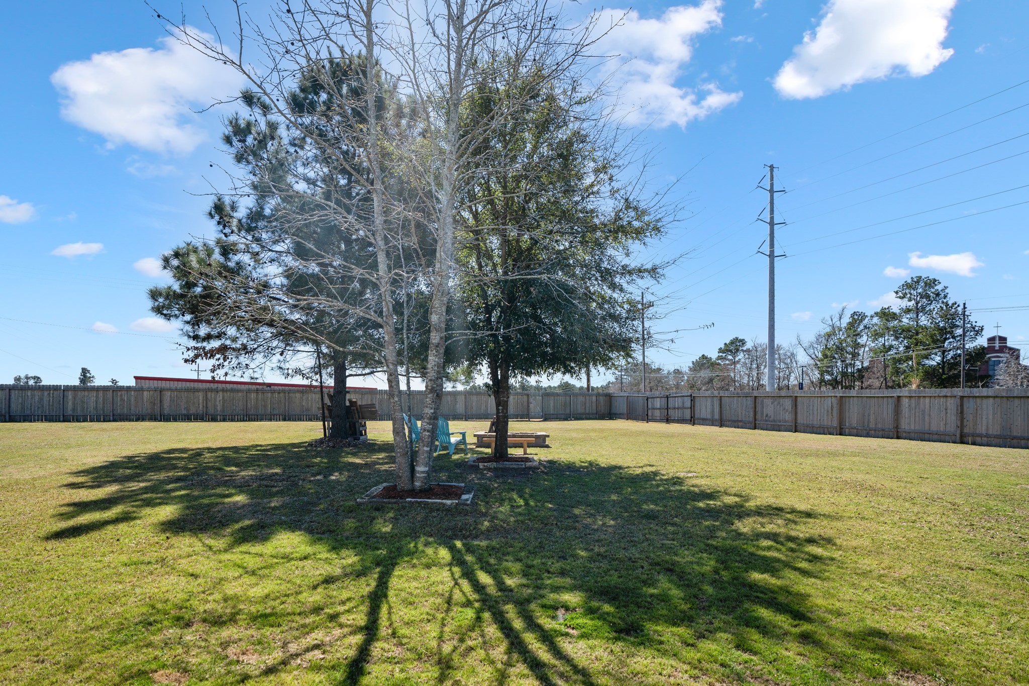 1730 Wandering Hills Road Conroe, TX 77304 - Photo 35 of 45 a view of a swimming pool with an outdoor space and seating area
