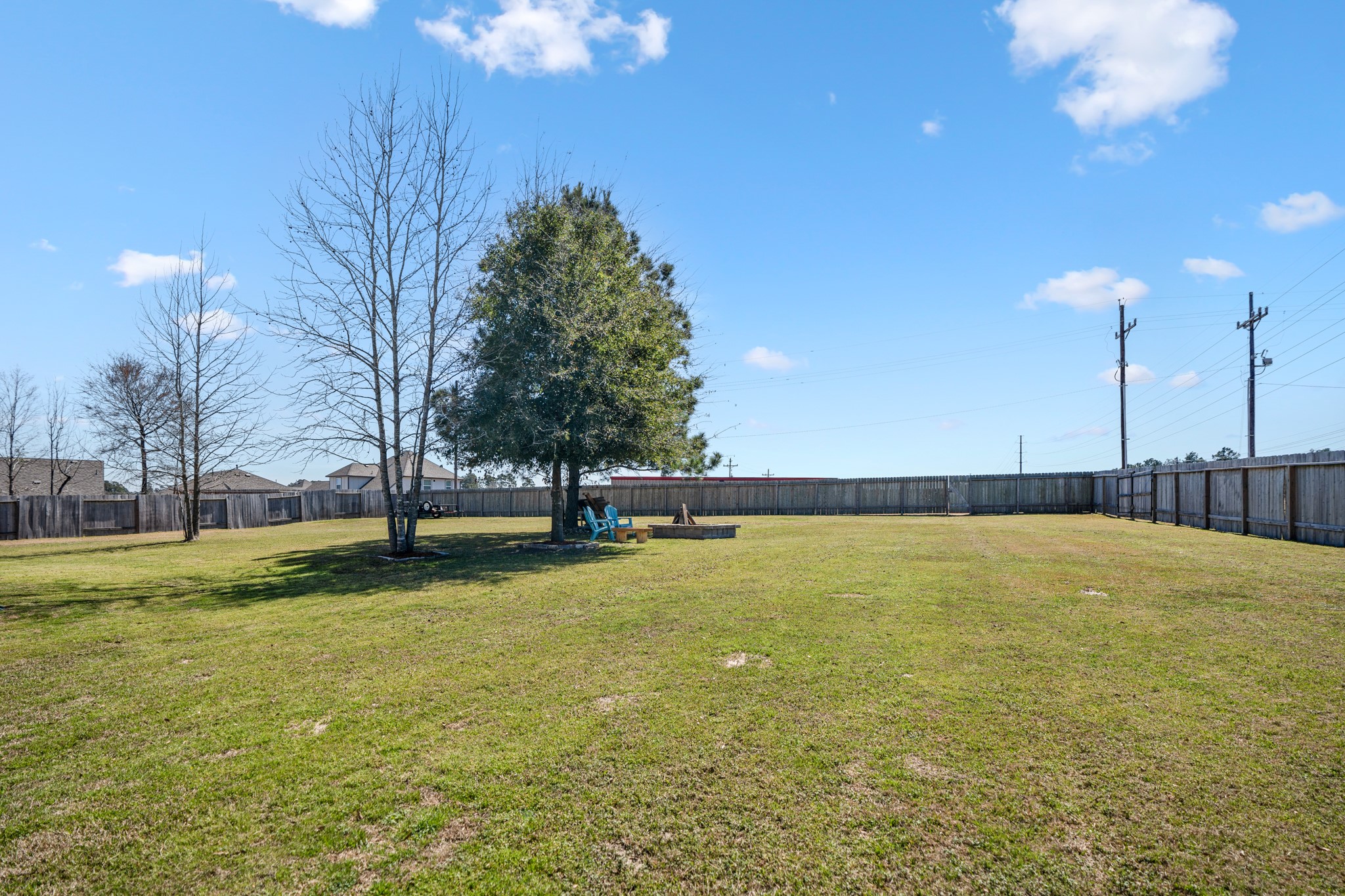 1730 Wandering Hills Road Conroe, TX 77304 - Photo 37 of 45 a view of a swimming pool with an outdoor space and seating area