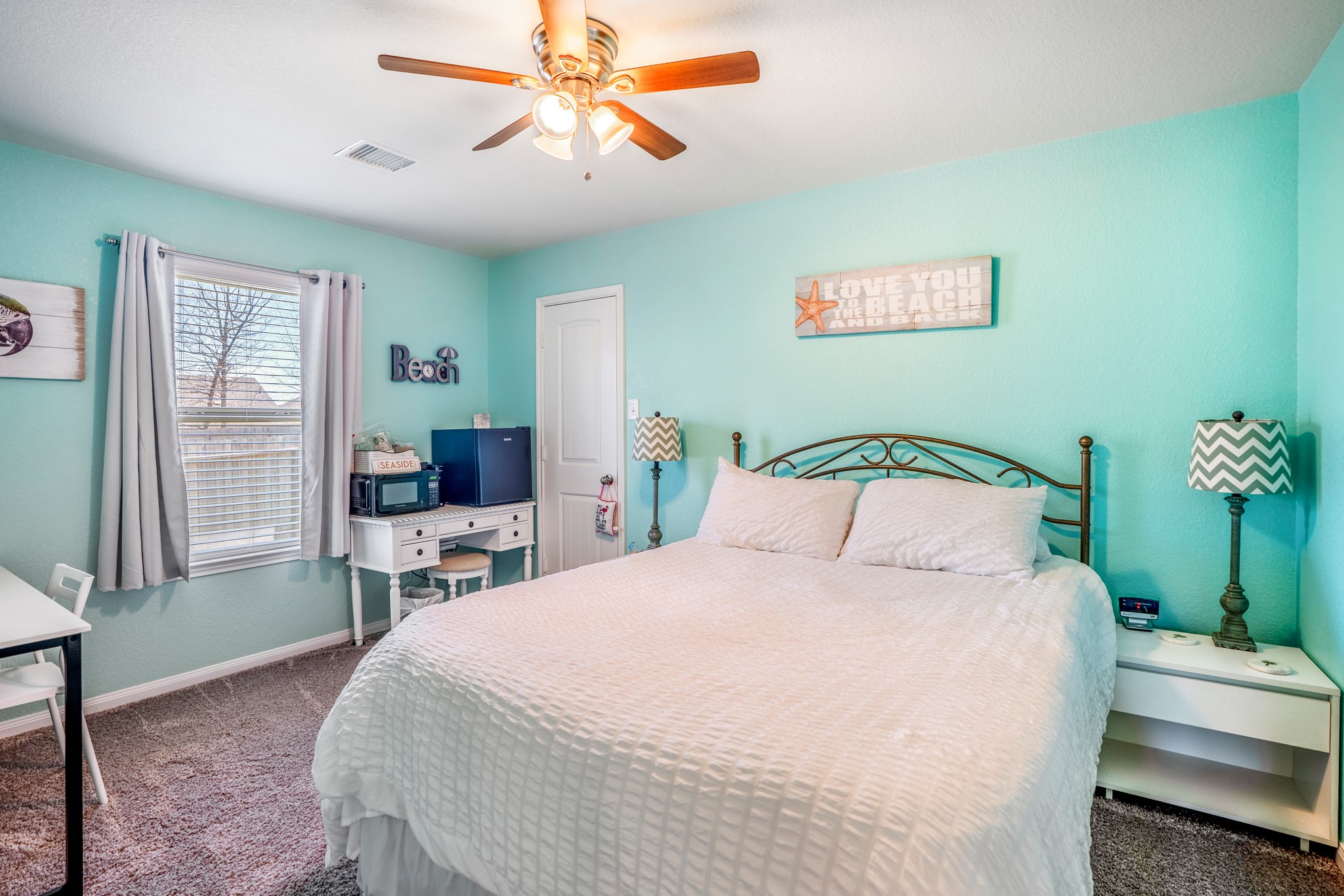 1730 Wandering Hills Road Conroe, TX 77304 - Photo 6 of 45 a bedroom with a bed and a table