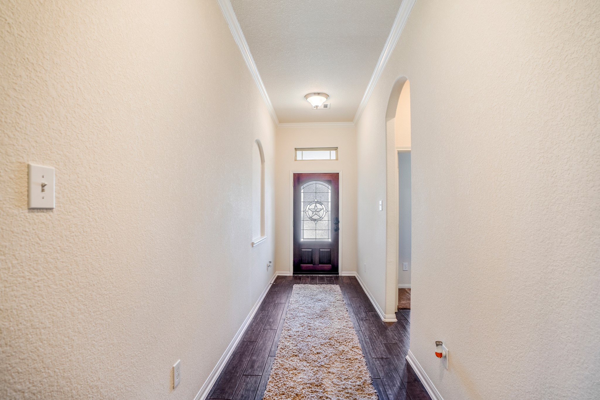 1730 Wandering Hills Road Conroe, TX 77304 - Photo 9 of 45 a view of a hallway with a white walls
