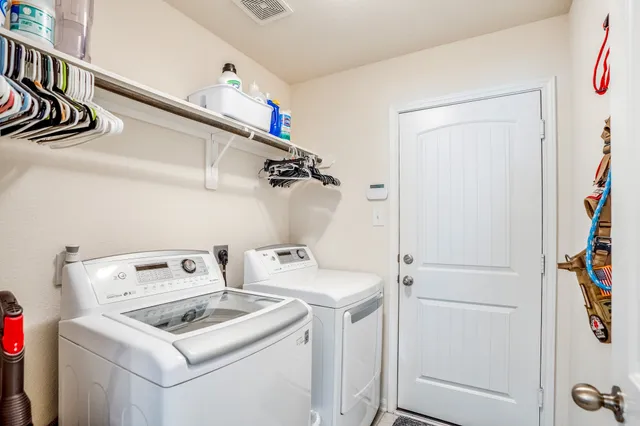 a utility room with dryer and washer