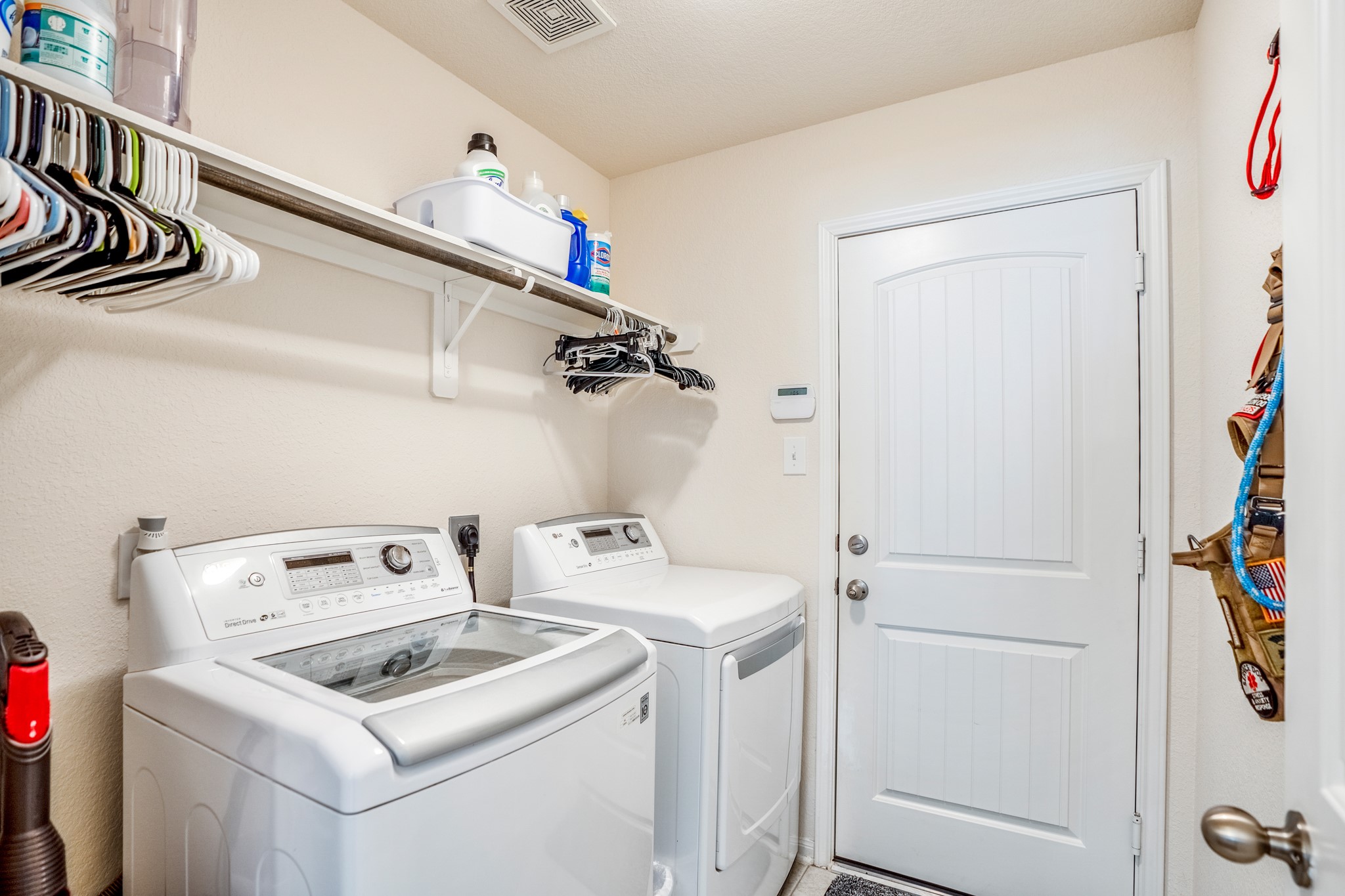 1730 Wandering Hills Road Conroe, TX 77304 - Photo 10 of 45 a utility room with dryer and washer
