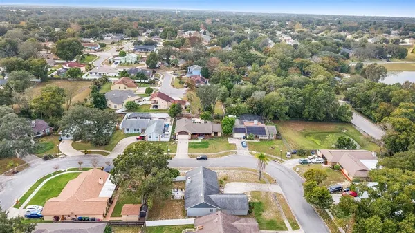 an aerial view of a house with a swimming pool