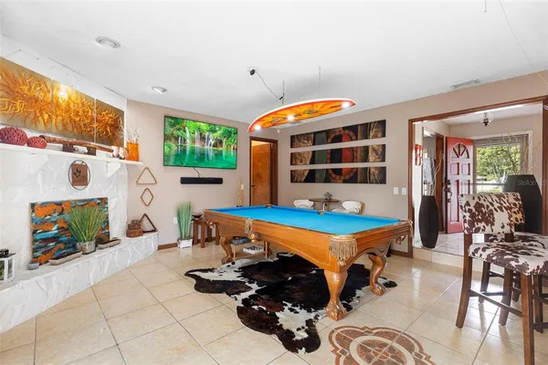 a bedroom with furniture and flat screen tv