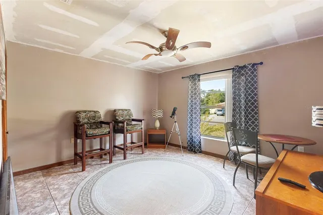 a living room with furniture a table and chairs