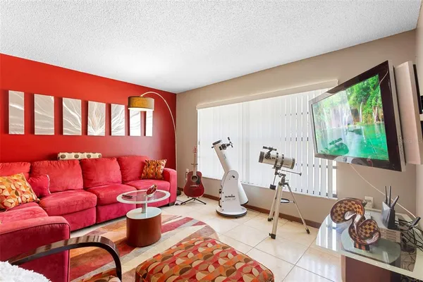 a living room with furniture and a window