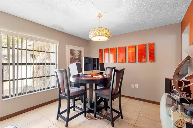 a view of a dining room with furniture window and outside view