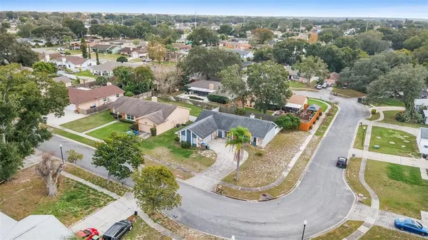 an aerial view of a house with outdoor space