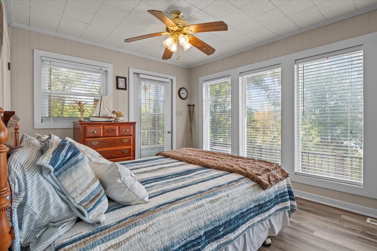 38 Lakeland Road Waverly, TN 37185 - Photo 13 of 41 a bedroom with a large bed and a chandelier fan