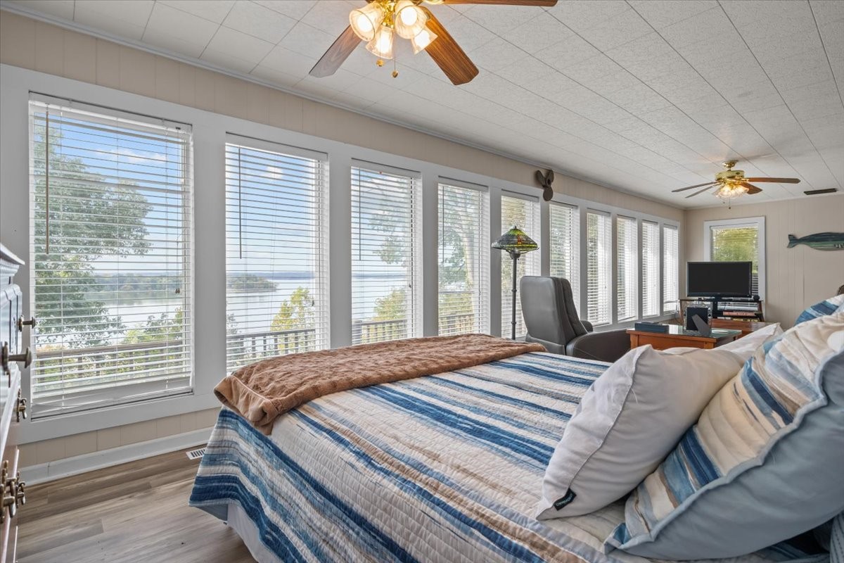 38 Lakeland Road Waverly, TN 37185 - Photo 14 of 41 a bedroom with a bed and large windows