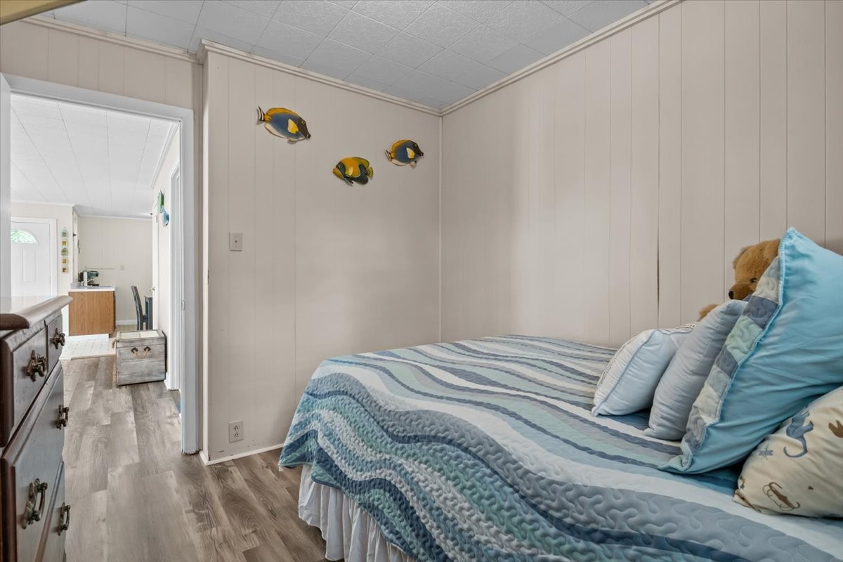 38 Lakeland Road Waverly, TN 37185 - Photo 16 of 41 a bedroom with a bed and wooden floor