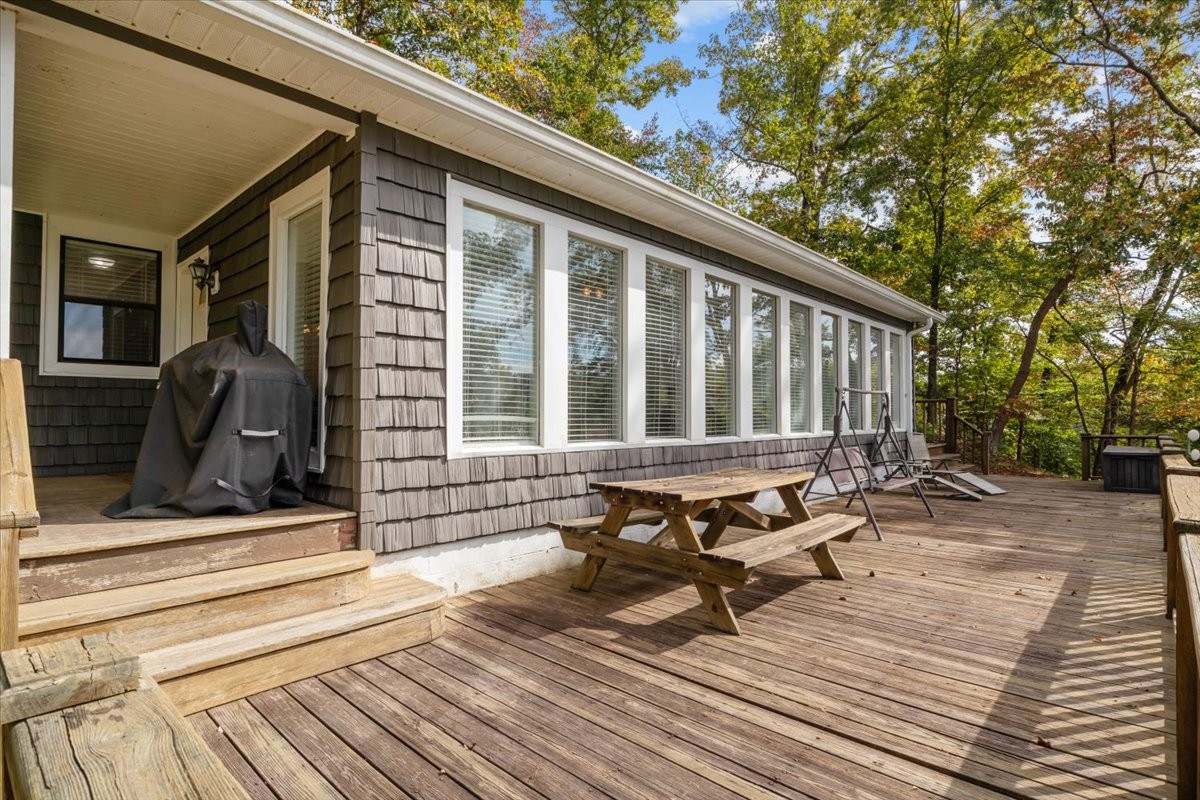 38 Lakeland Road Waverly, TN 37185 - Photo 2 of 41 a view of a roof deck with wooden floor and outdoor seating