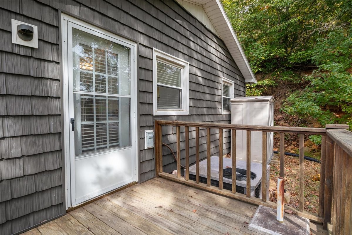 38 Lakeland Road Waverly, TN 37185 - Photo 23 of 41 a view of a balcony with wooden floor and iron fence