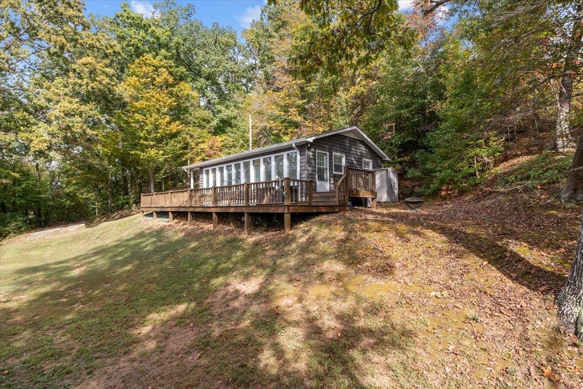 38 Lakeland Road Waverly, TN 37185 - Photo 31 of 41 a view of a house with wooden deck and trees