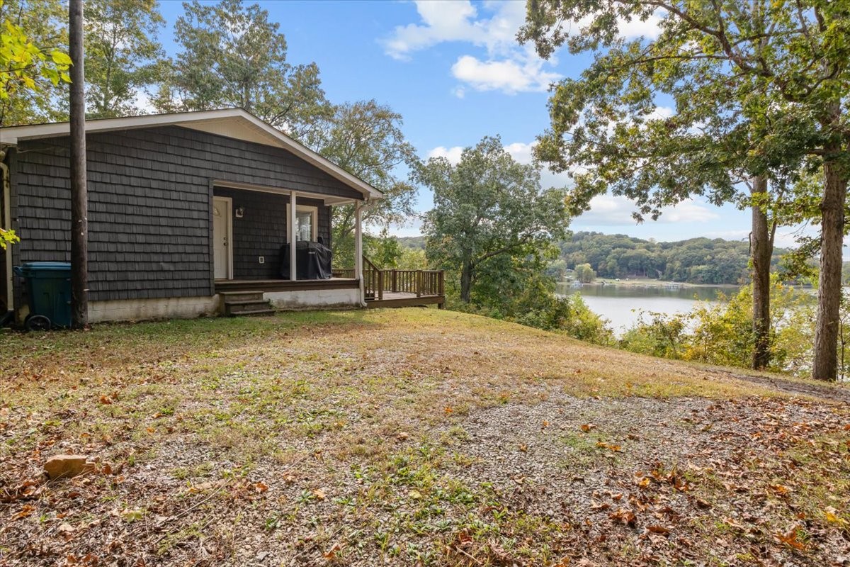 38 Lakeland Road Waverly, TN 37185 - Photo 34 of 41 a view of a house with a yard and wooden fence
