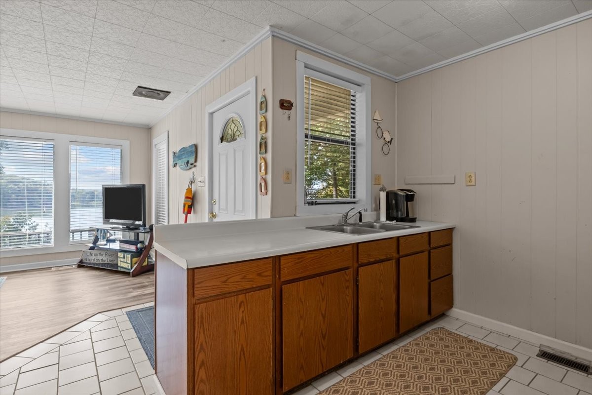 38 Lakeland Road Waverly, TN 37185 - Photo 8 of 41 a kitchen with stainless steel appliances granite countertop a sink and a wooden cabinets