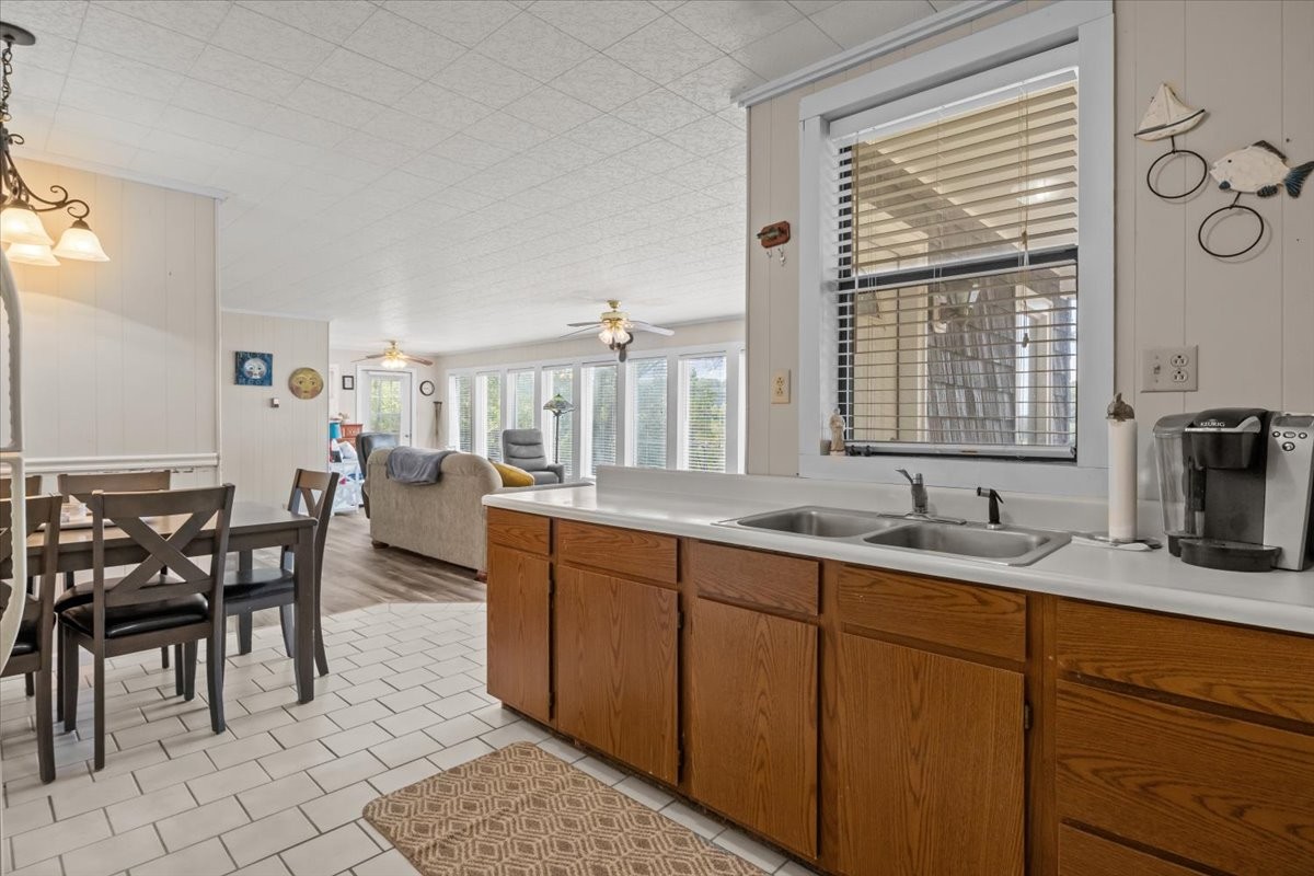 38 Lakeland Road Waverly, TN 37185 - Photo 9 of 41 a kitchen with granite countertop sink dining table and chairs