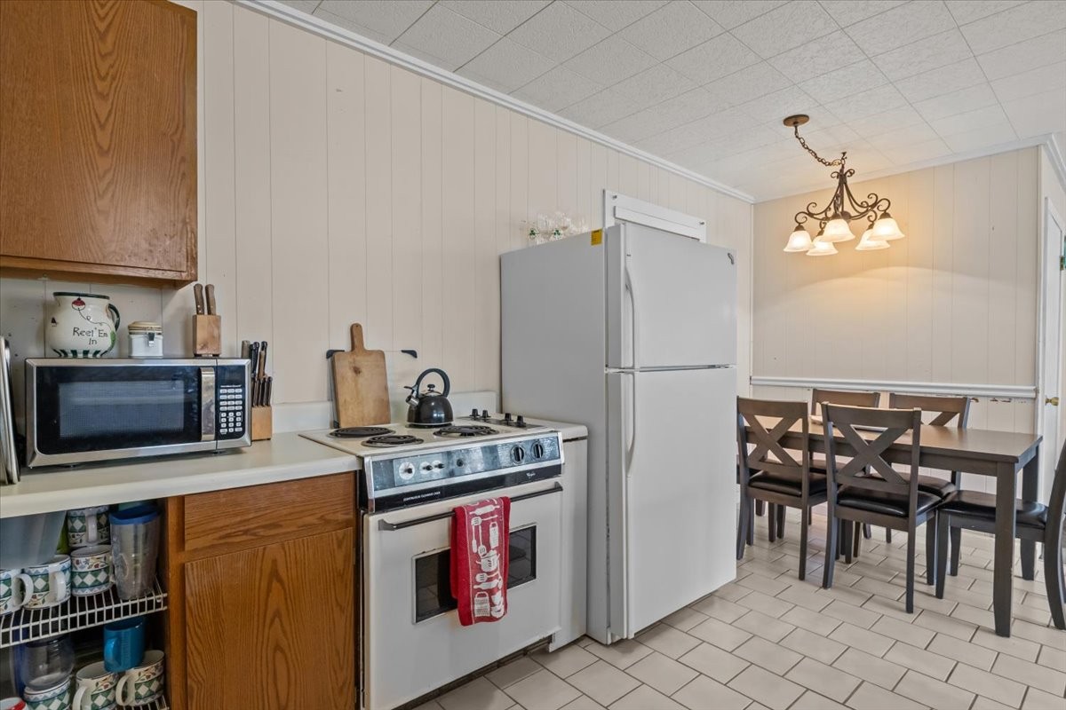 38 Lakeland Road Waverly, TN 37185 - Photo 10 of 41 a kitchen with stainless steel appliances granite countertop a stove a refrigerator and a microwave