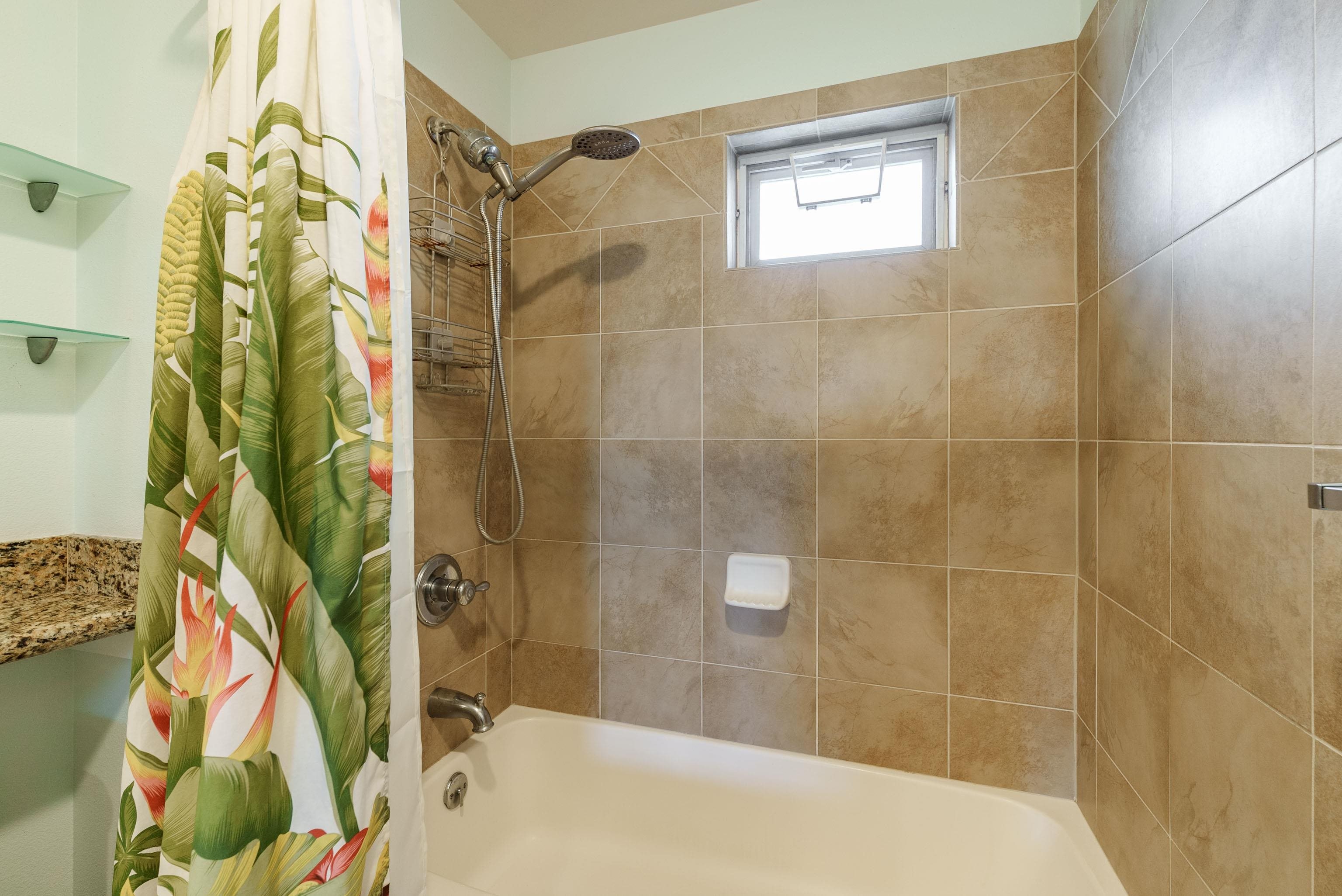 3708 Lower Honoapiilani Road, Unit E43 Lahaina, HI 96761 - Photo 21 of 40 a bathroom with a bathtub and shower