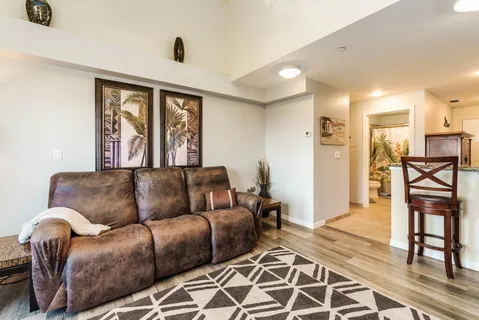 a kitchen with granite countertop cabinets stainless steel appliances and a counter space