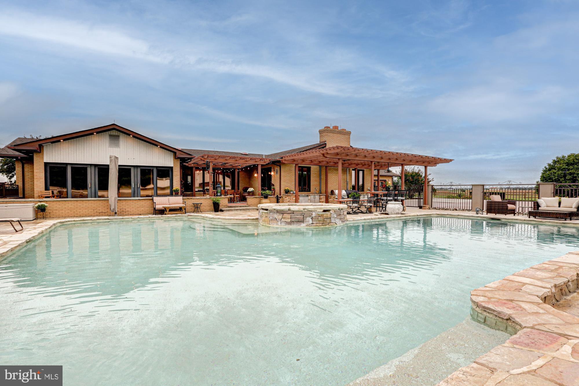 550 Green Giant Road Townsend, DE 19734 - Photo 30 of 145 a swimming pool view with a seating space and a garden view