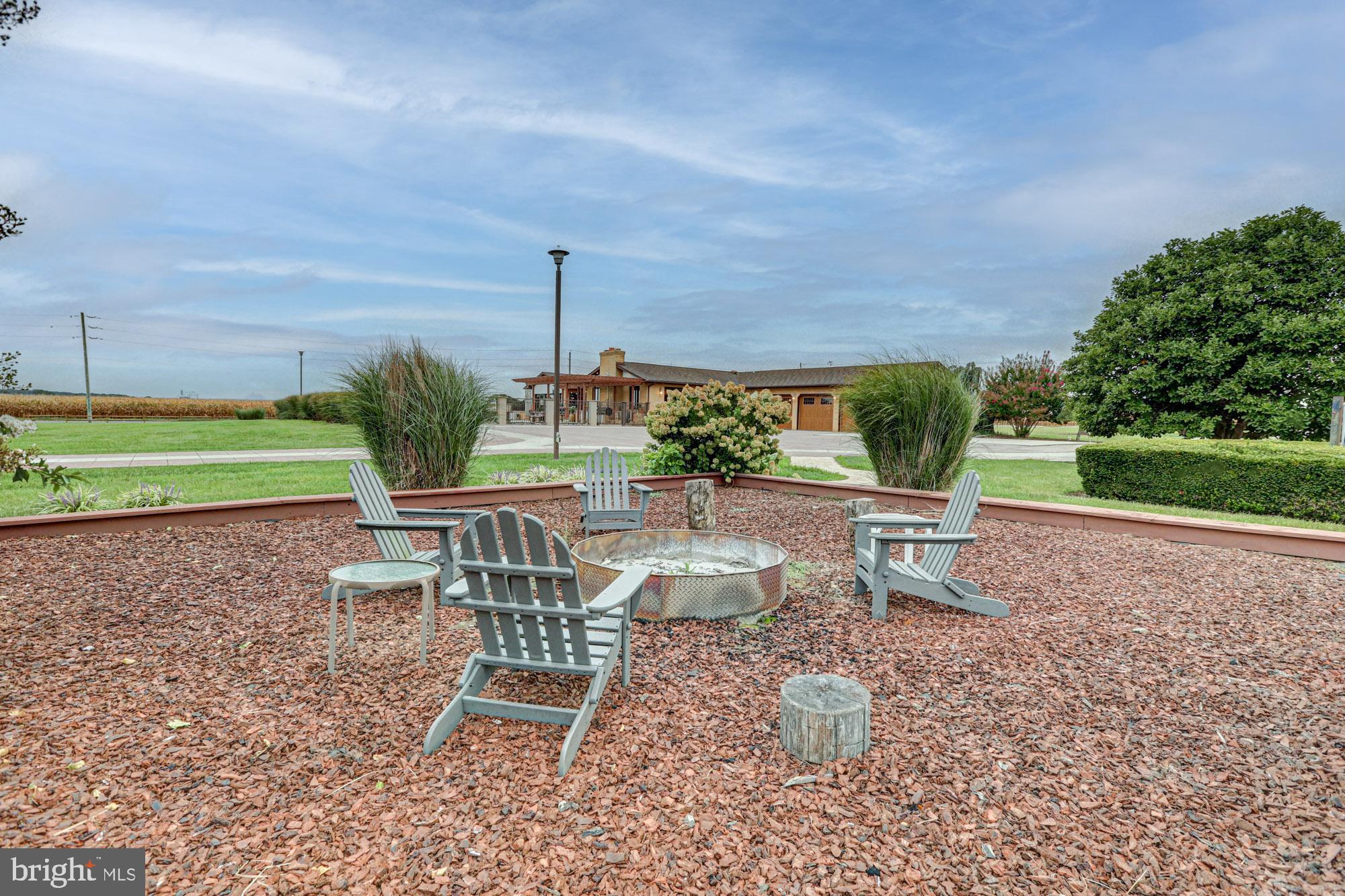 550 Green Giant Road Townsend, DE 19734 - Photo 38 of 145 a view of a patio with a table chairs and a table