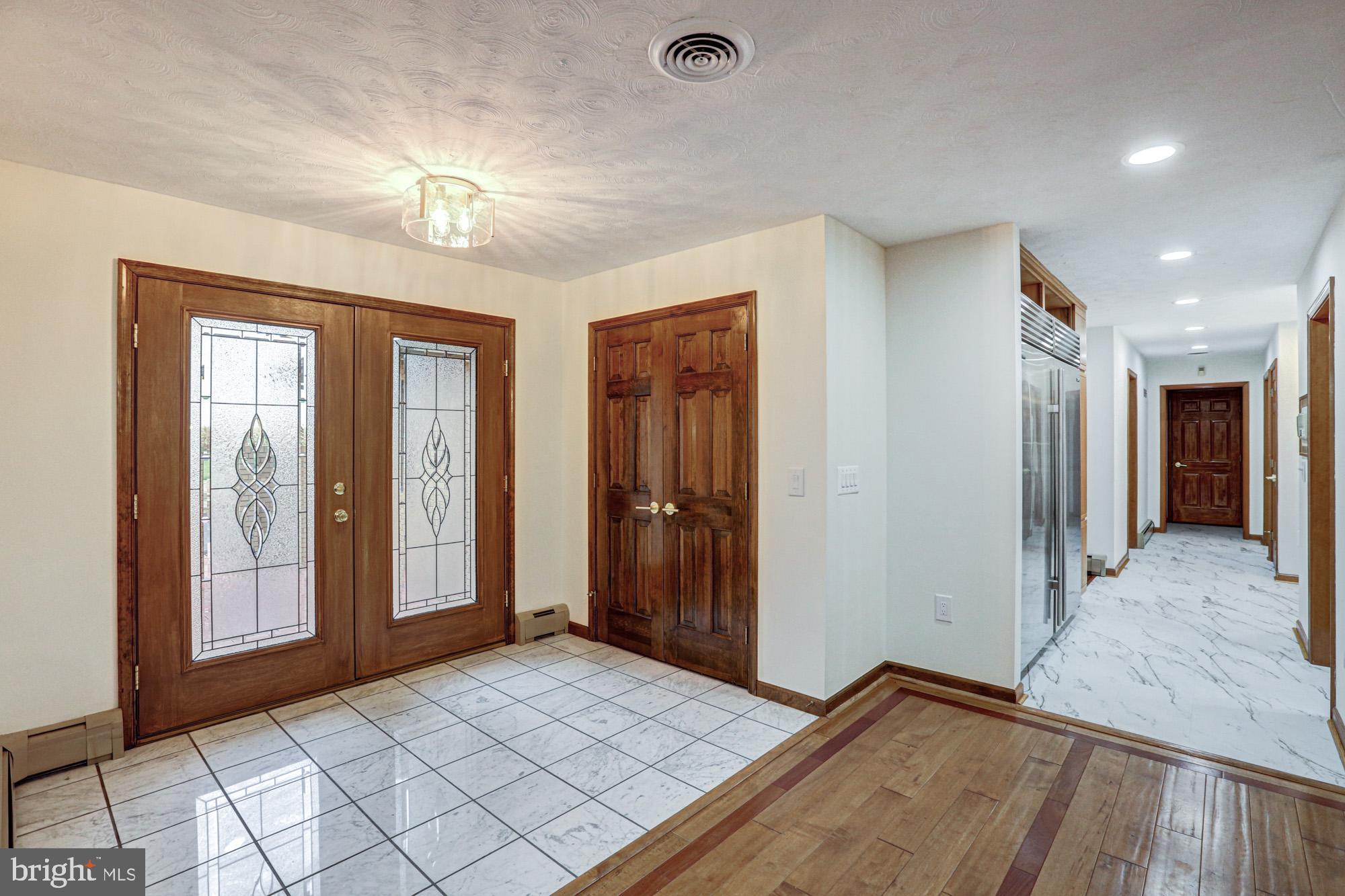 550 Green Giant Road Townsend, DE 19734 - Photo 53 of 145 a view of livingroom with hallway and hallway with wooden floor