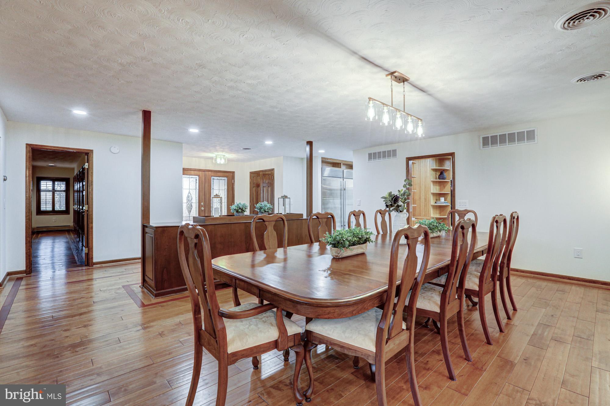 550 Green Giant Road Townsend, DE 19734 - Photo 57 of 145 a view of a dining room with furniture and wooden floor