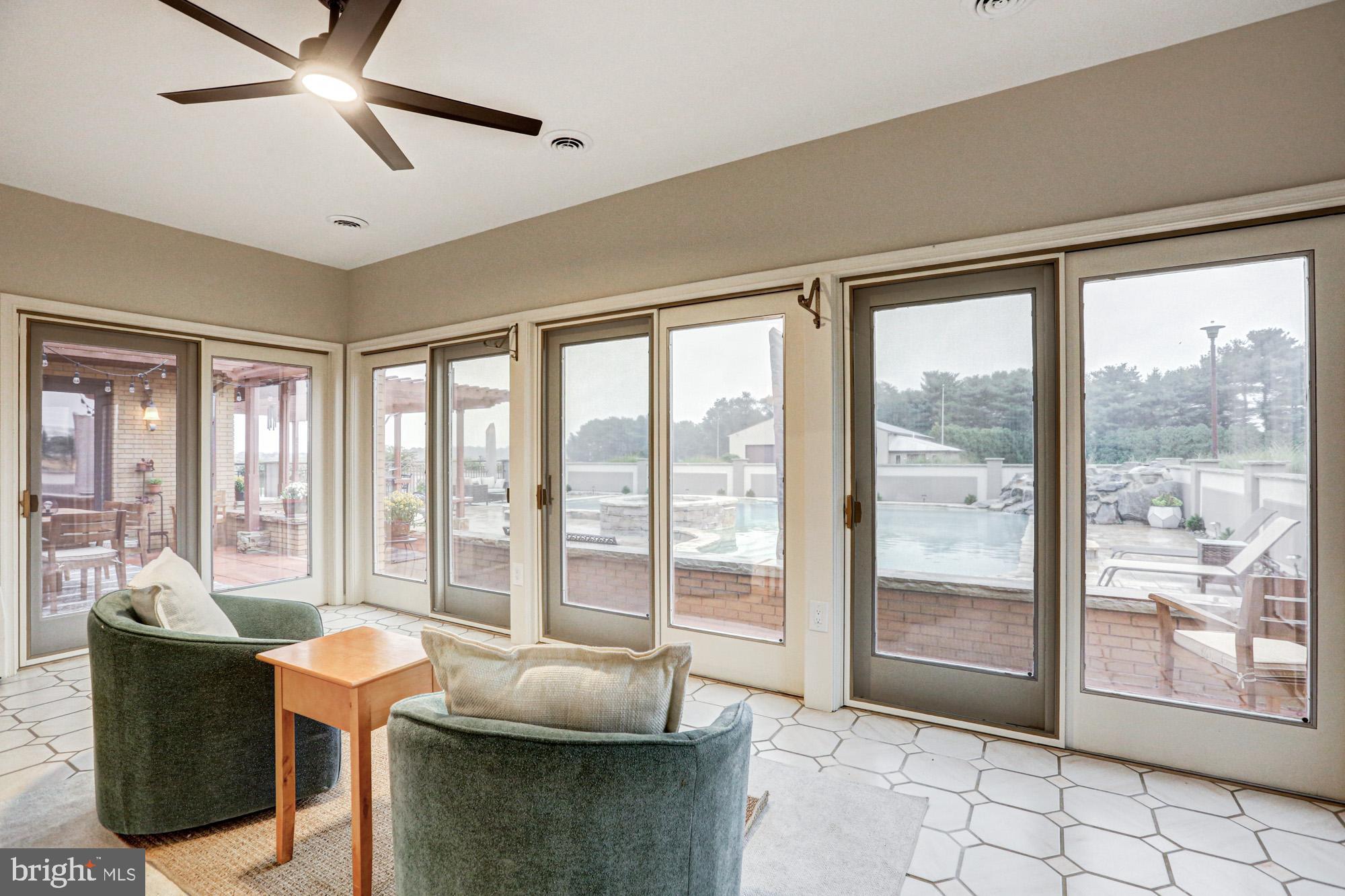 550 Green Giant Road Townsend, DE 19734 - Photo 64 of 145 a living room with furniture and large windows