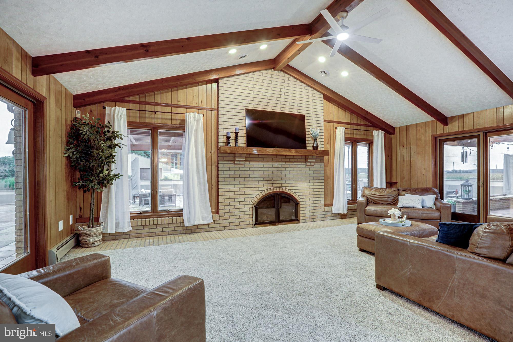 550 Green Giant Road Townsend, DE 19734 - Photo 88 of 145 a living room with furniture a fireplace and a flat screen tv