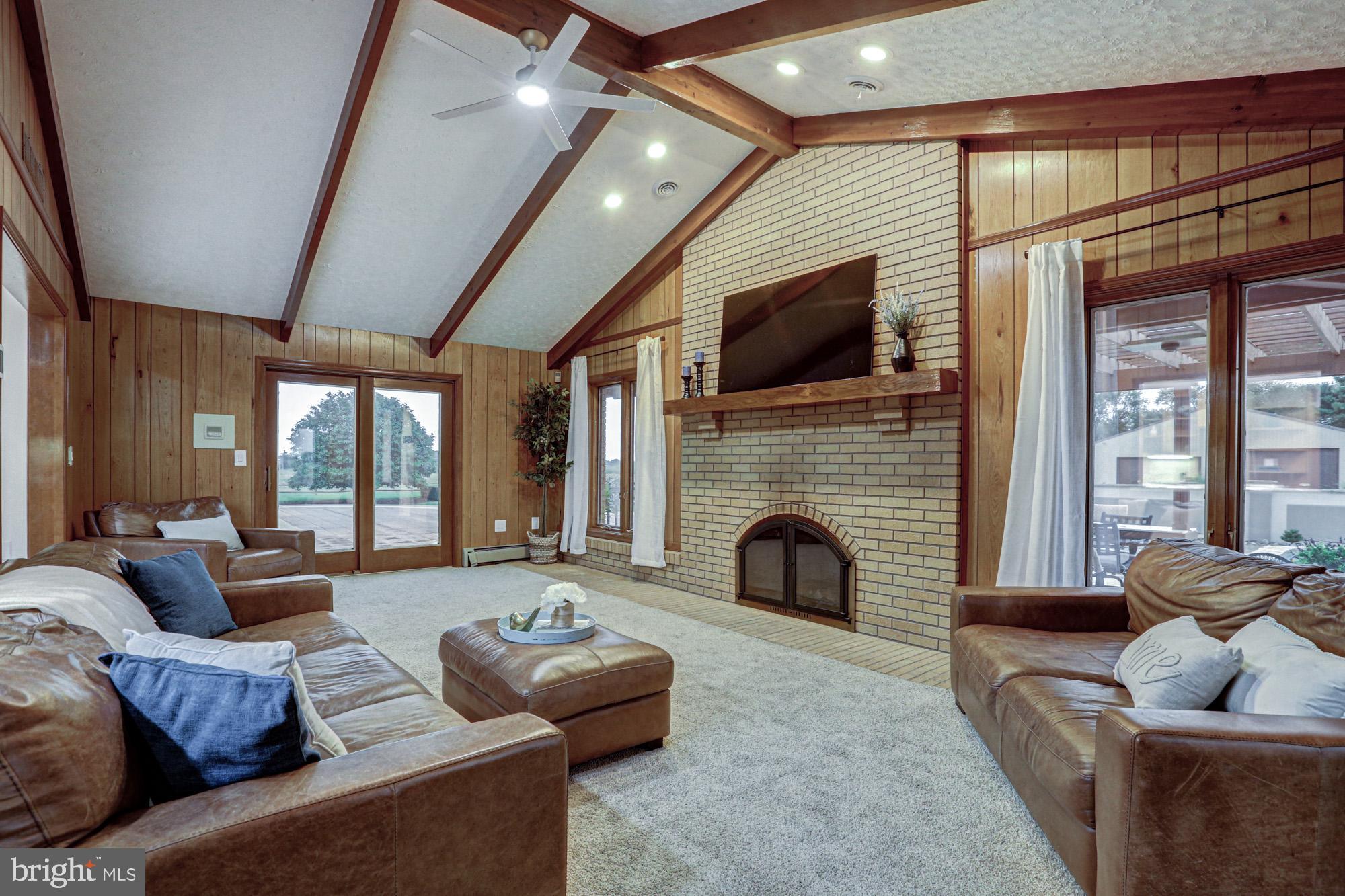 550 Green Giant Road Townsend, DE 19734 - Photo 90 of 145 a living room with furniture flat screen tv and a fireplace
