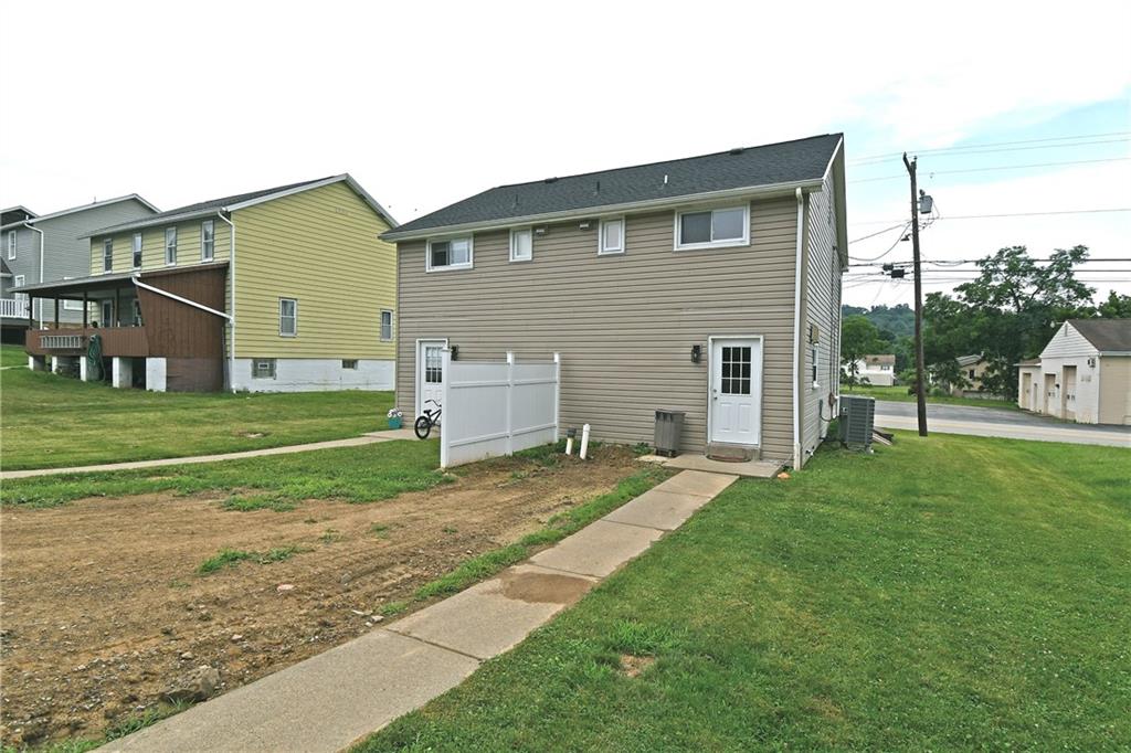 401-403 Georgetown Road Lawrence, PA 15055 - Photo 5 of 23 a view of a house with a backyard