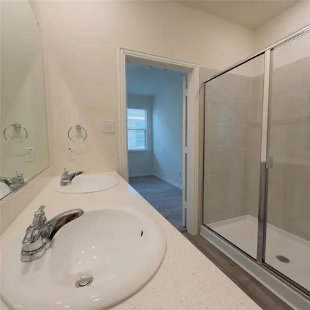 a bathroom with a tub and shower