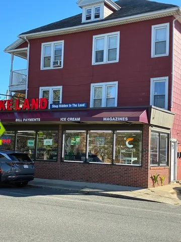 a view of building with car parked