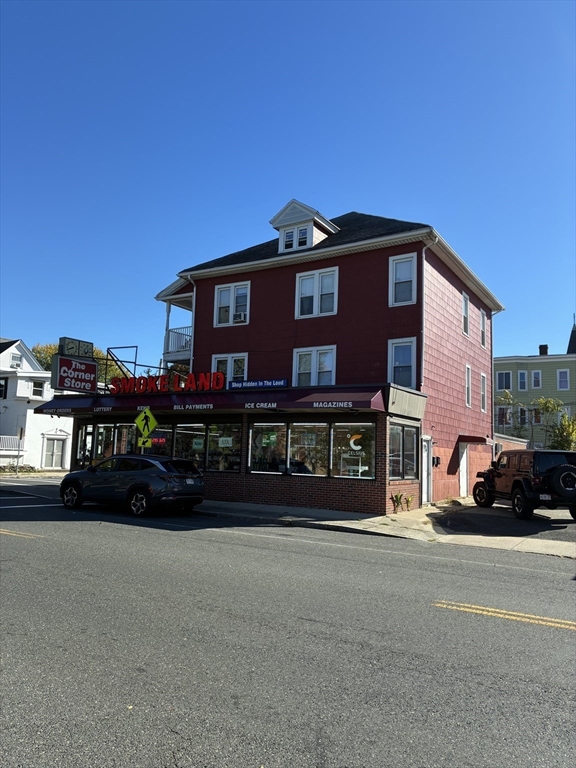 438 Front Street Chicopee, MA 01013 - Photo 3 of 4 a front view of a house with a yard